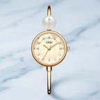 gold-bangle-pearl-watch-front-view-luna-precision