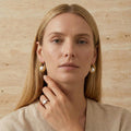 gold-plated-pearl-knot-earrings-front-luna-knot