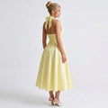 yellow-acetate-halter-midi-dress-side-model-alcestis-grace